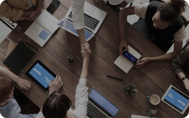 8 West Consulting colleagues shaking hands.