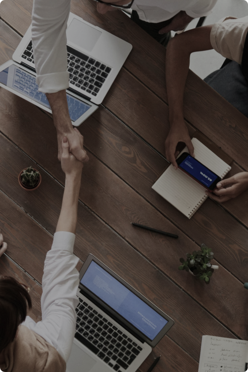 8 West Consulting colleagues shaking hands.