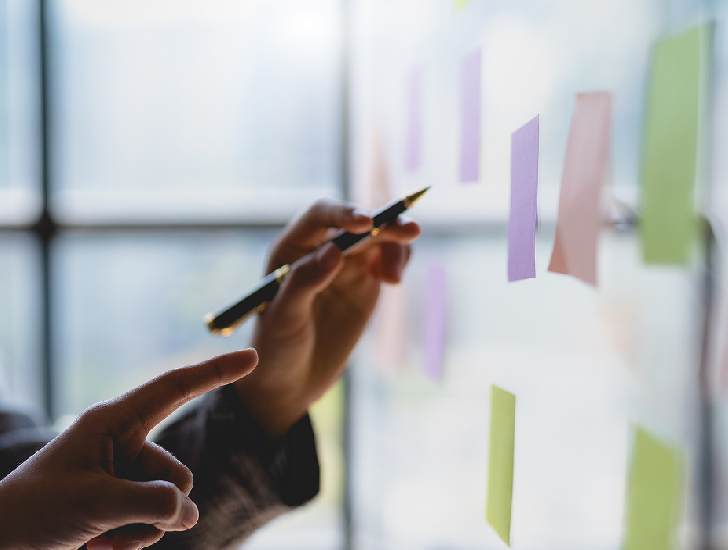 8 West Consulting - Employee consulting a Kanban board.